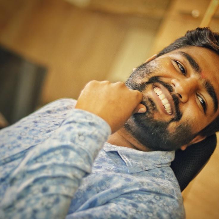 Kaveri Mehta, Lead Design Curator at CalmPaperShore, reviewing corporate floral arrangements